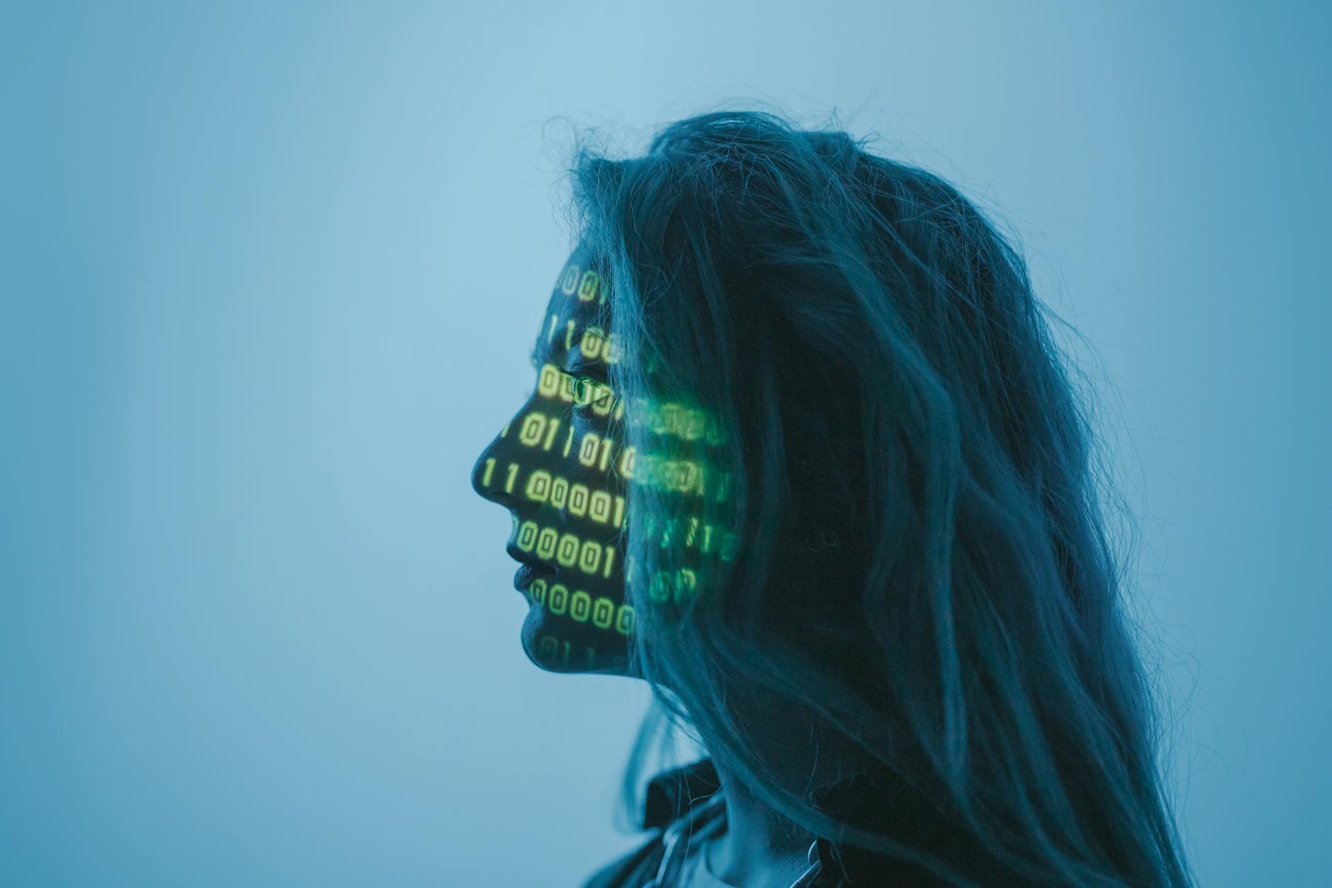 KB Marketing - Silhouette of a woman with binary code projected on her face in a digital concept set