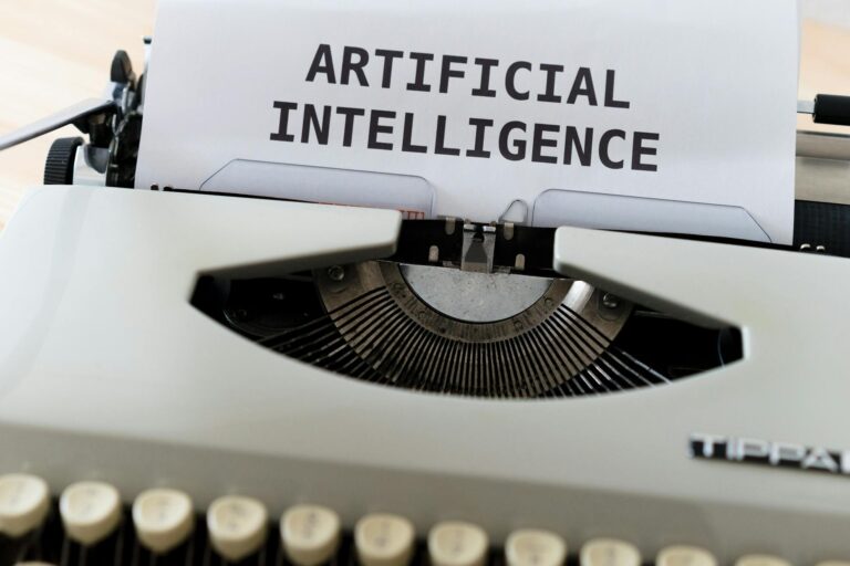A close-up of a typewriter showcasing 'ARTIFICIAL INTELLIGENCE' on paper.