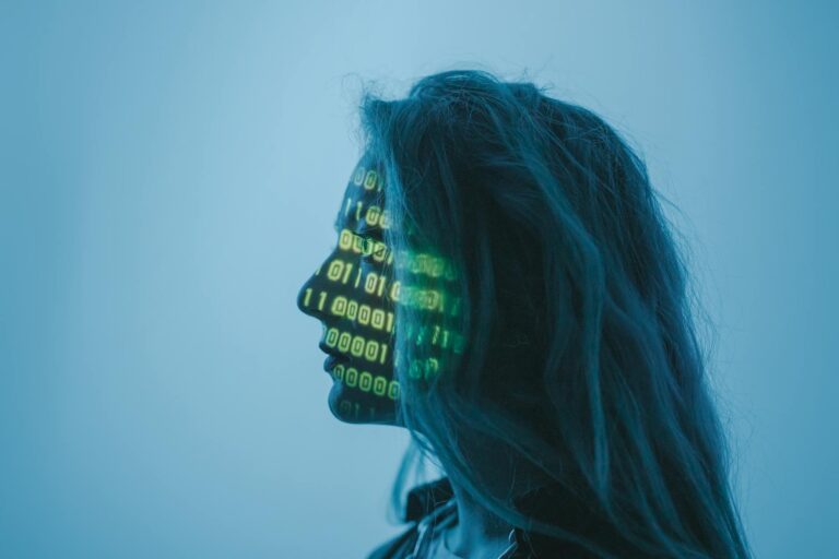 KB Marketing - Silhouette of a woman with binary code projected on her face in a digital concept set