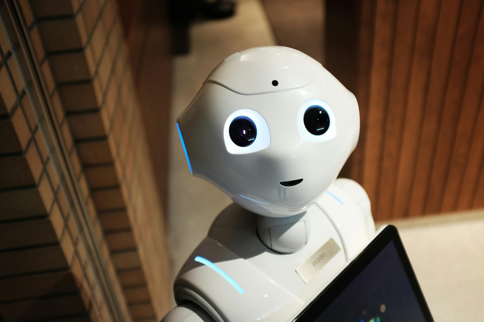 KB Marketing - A futuristic humanoid robot in an indoor Tokyo setting, showcasing modern technology.